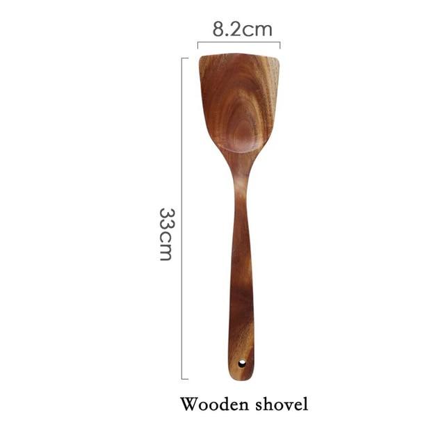 Wooden shovel from the Modern Thailand Natural Teak Wood Utensils Set of 7, eco-friendly with dimensions 33cm by 8.2cm.