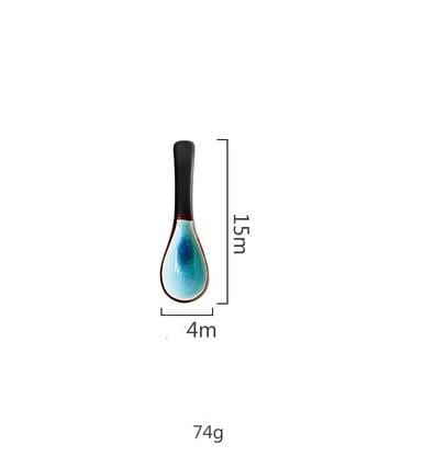 Rosmerta Bowls And Dishes spoon with blue crackle glaze, ergonomic black handle, eco-friendly porcelain, 15cm x 4cm dimensions, 74g.