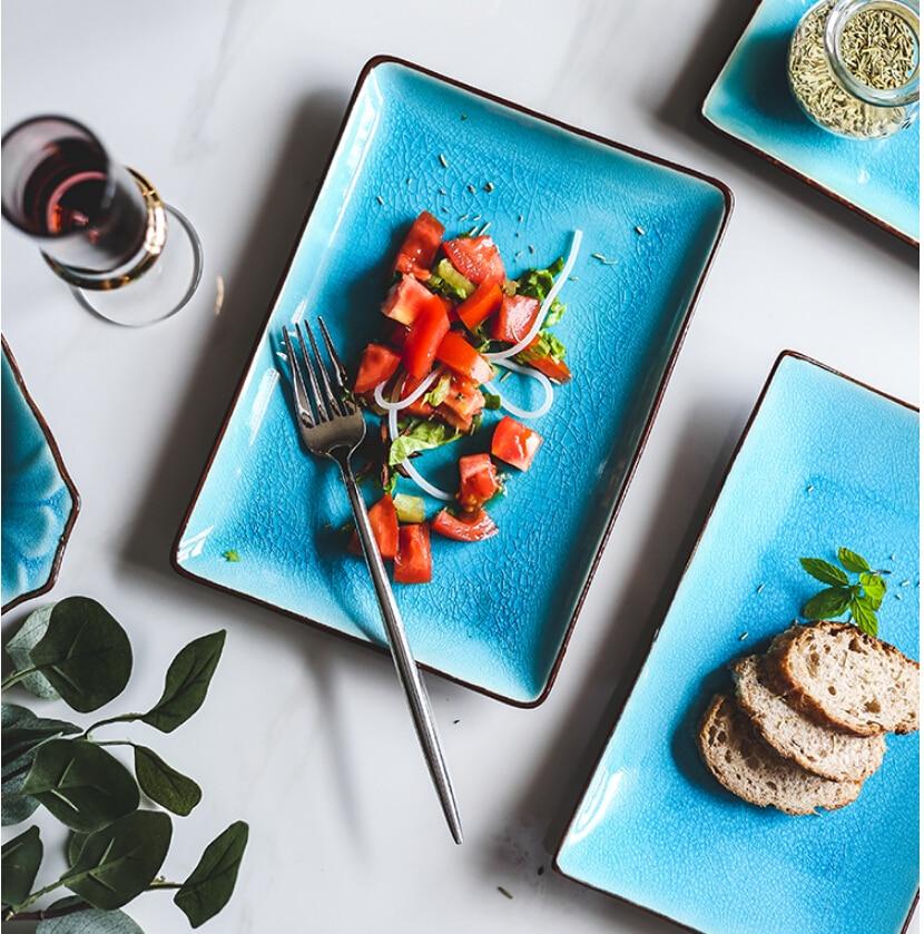 Rosmerta Bowls And Dishes - Japan style porcelain with crackle glaze, eco-friendly with CE certification, featuring a tomato salad and bread.
