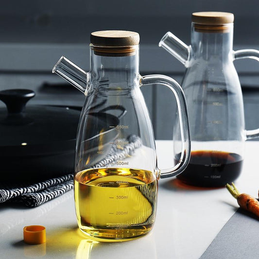 Modern Heat-Resistant Oil Bottle with eco-friendly engraved glass design, featuring wooden lid and precise measurement markings.