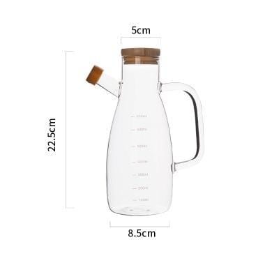 Modern Heat-Resistant Oil Bottle with eco-friendly glass, round shape, and engraved measurement markings, certified by CE, SGS, FDA.