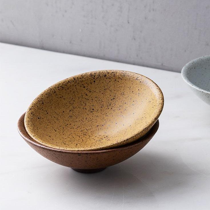 Elegant Hemera Ceramic Bowl with speckled design, perfect for modern kitchens and dining aesthetics. Currently unavailable.