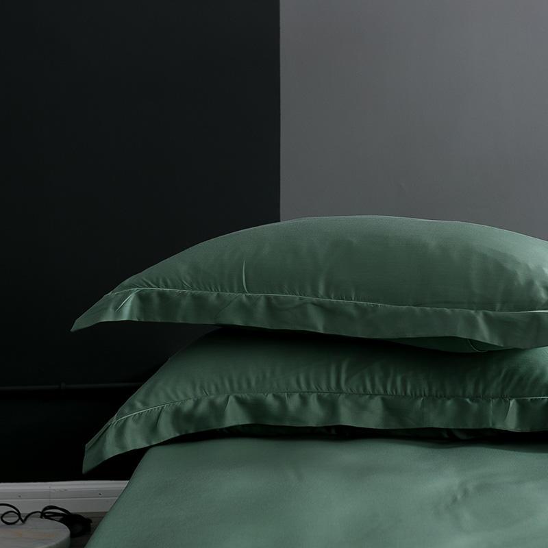 Karen Solid Color Lyocell Duvet Cover Set in green on bed, showcasing soft and modern boho style bedding.