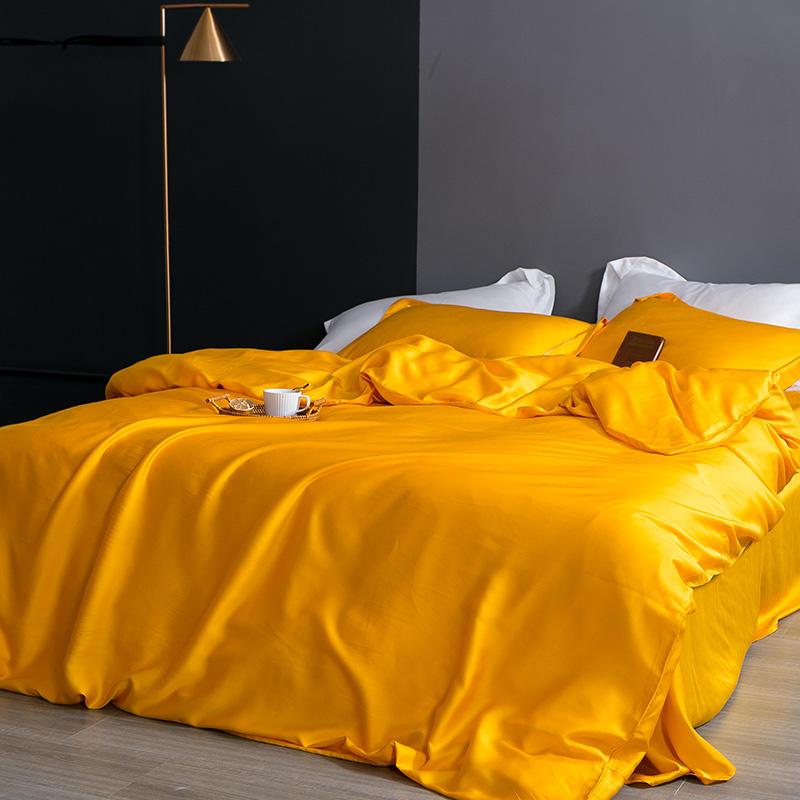 Karen Solid Color Lyocell Duvet Cover Set in bright yellow on a bed, showcasing modern and boho style without patterns.