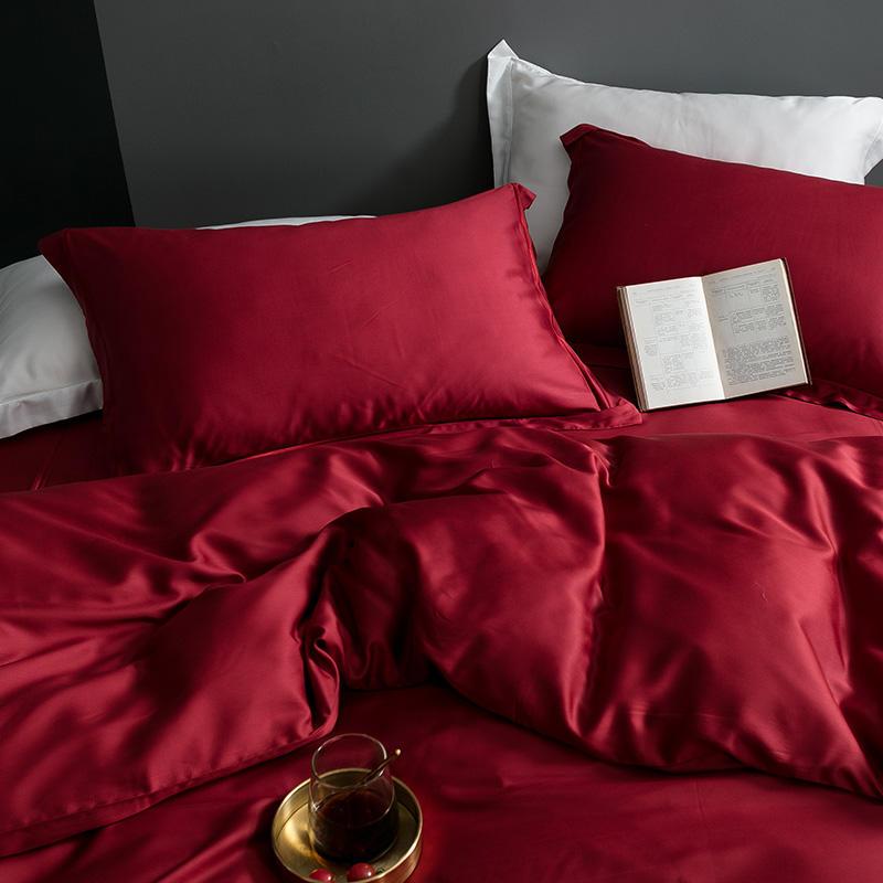 Karen Solid Color Lyocell Duvet Cover Set in rich red, showcasing modern and boho style bedding with a luxurious silky finish.