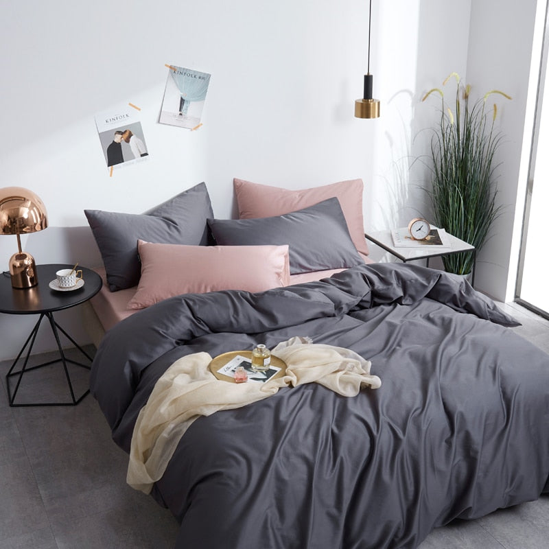 Graphite Grace Silk Duvet Cover Set (Premium Egyptian Cotton) 600TC on a modern styled bed, featuring gray and pink tones.