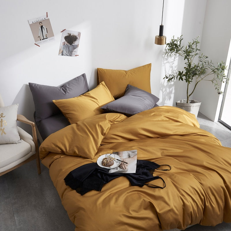 Butterscotch Grace Silk Duvet Cover Set (Premium Egyptian Cotton) 600TC on a neatly made bed in a modern bedroom setting.
