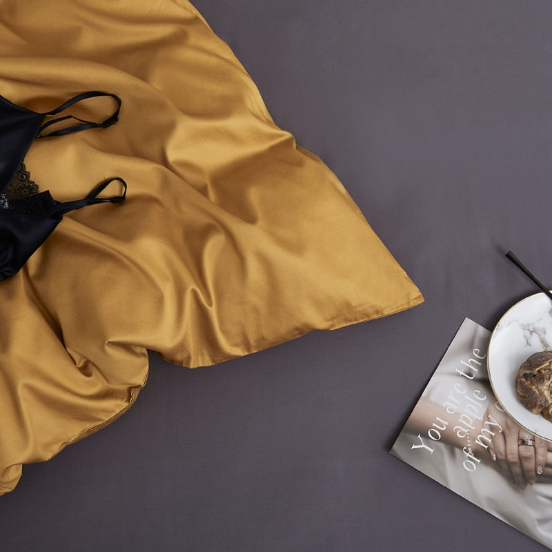 Butterscotch Grace Silk Duvet Cover Set (Premium Egyptian Cotton) 600TC in mustard color displayed on bed.