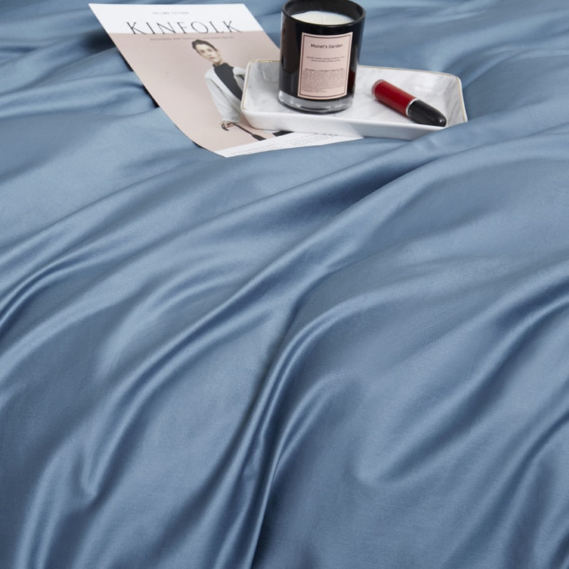 Zenith Grace Silk Duvet Cover Set (Premium Egyptian Cotton) 600TC in solid Zenith color displayed with a magazine and candle on bed