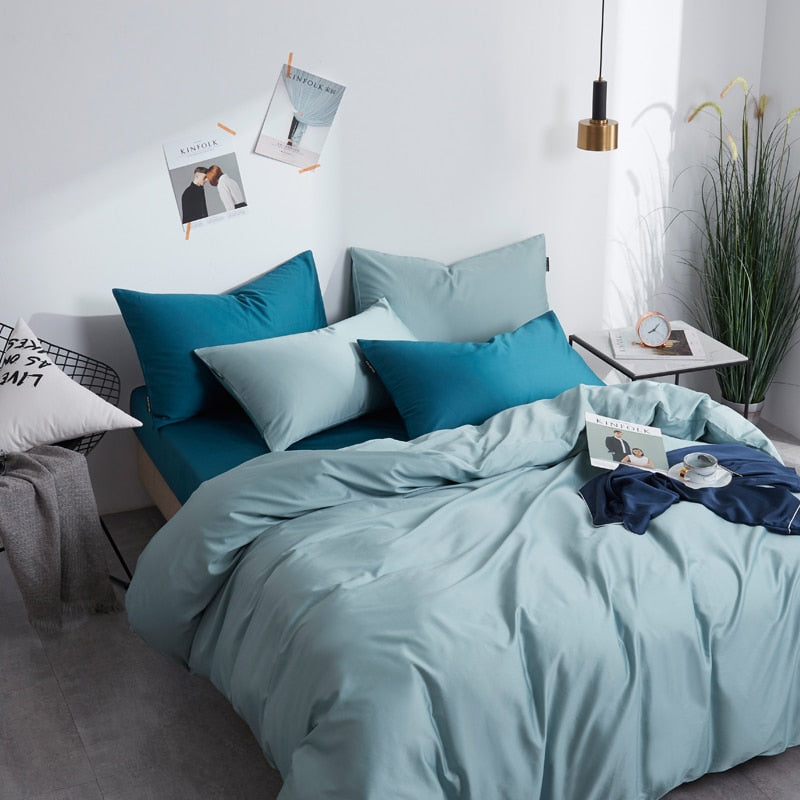 Turquoise Grace Silk Duvet Cover Set (Premium Egyptian Cotton) 600TC displayed on a bed with pillows in a stylish bedroom setting.