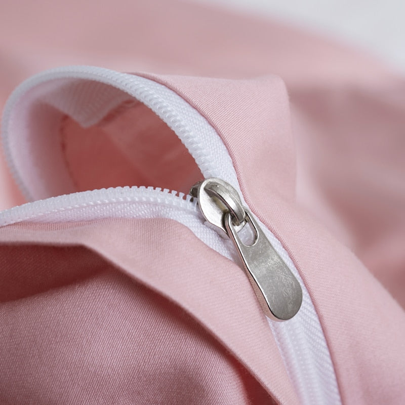 Close-up of a zipper on Flamingo Grace Silk Duvet Cover Set (Premium Egyptian Cotton) 600TC in pink