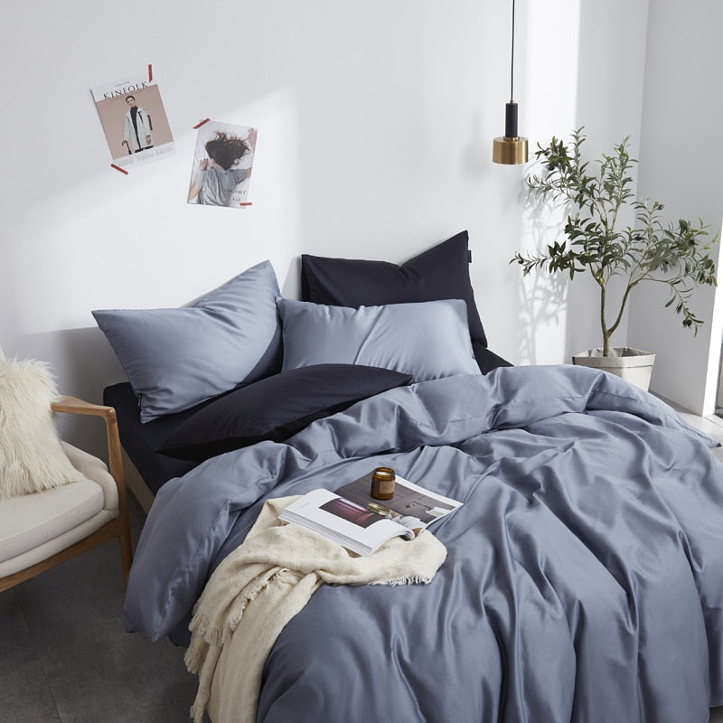 Florentine Grace Silk Duvet Cover Set (Premium Egyptian Cotton) 600TC in blue with pillowcases and flat sheet in a cozy bedroom setting.