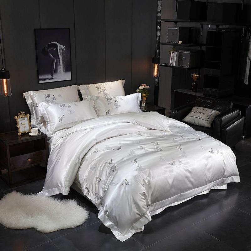 Platinum Butterfly Duvet Cover Set with satin and cotton fabric in a minimalist bedroom setting, showcasing elegant design and style.