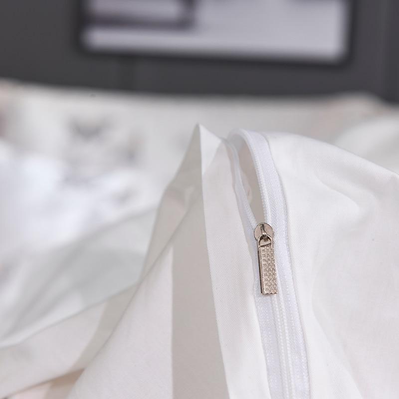 Close-up of Platinum Butterfly Duvet Cover Set zipper detail in satin and cotton fabric, showcasing minimalist design.