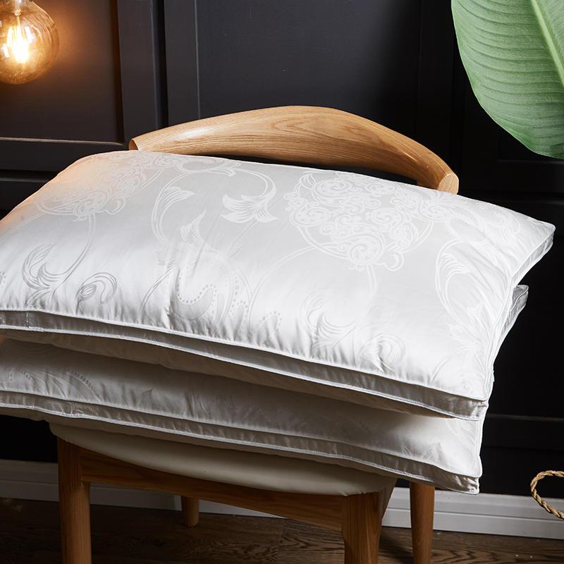 Vincenzo Pillows Set of 2 Goose Down on a chair with elegant embroidered texture, perfect for bedroom decor and Egyptian cotton bedding.