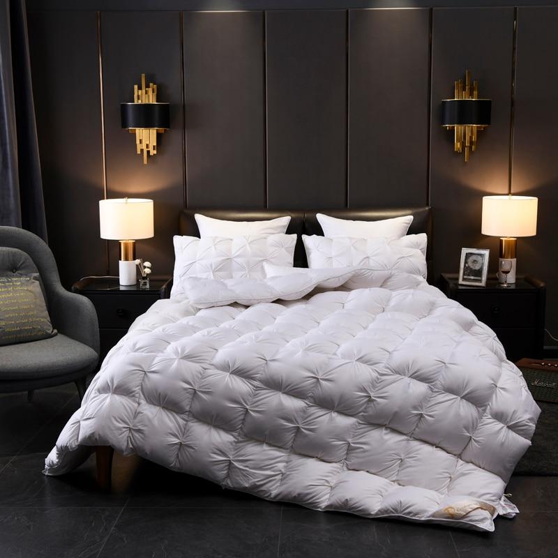 Giuseppina 1000 Thread Count Goose Down Comforter Duvet in an elegant bedroom setting with plush pillows and modern decor.