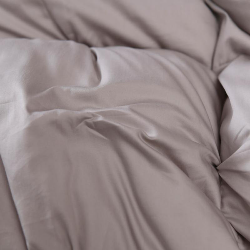 Close-up of Giuseppina 1000 Thread Count Goose Down Comforter Duvet in soft Egyptian cotton for luxurious bedroom elegance.