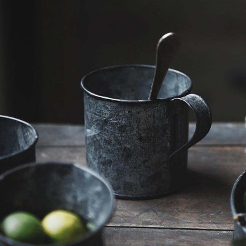 Vintage Galvanized Steel Storage Set of 9 pc on rustic table with cups and lemons, eco-friendly metal storage jars.