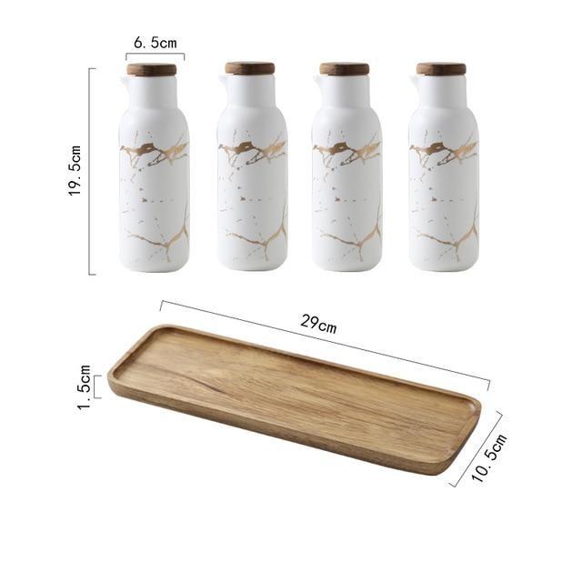 Set of four marble-design ceramic bottles with wooden tray, 29cm. Ideal for kitchen storage or display.