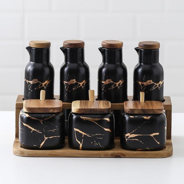 Maci 8-Piece Spice Ceramic Jar With Wooden Lid set in modern design with black ceramic and wooden accents for kitchen storage