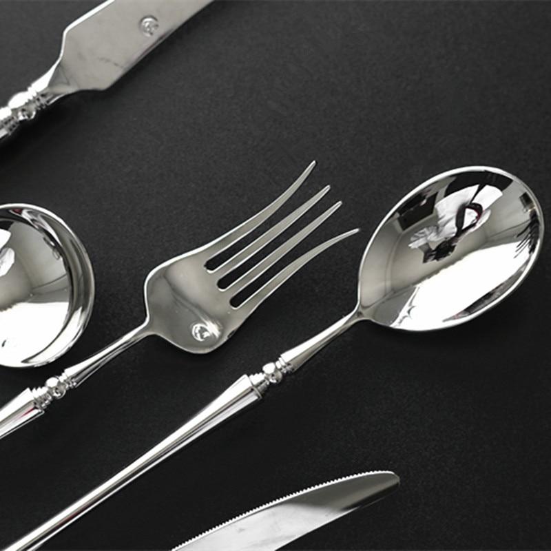 Zina Flatware Set 24-Piece (Polished) in stainless steel with modern design on black background.