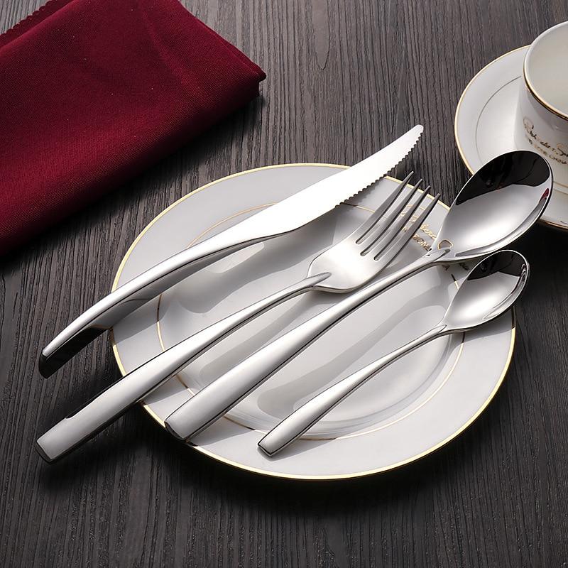 Talia Shiny Silver Flatware 24-Piece Set displayed on a formal table setting with a polished silver finish and tapered profile.