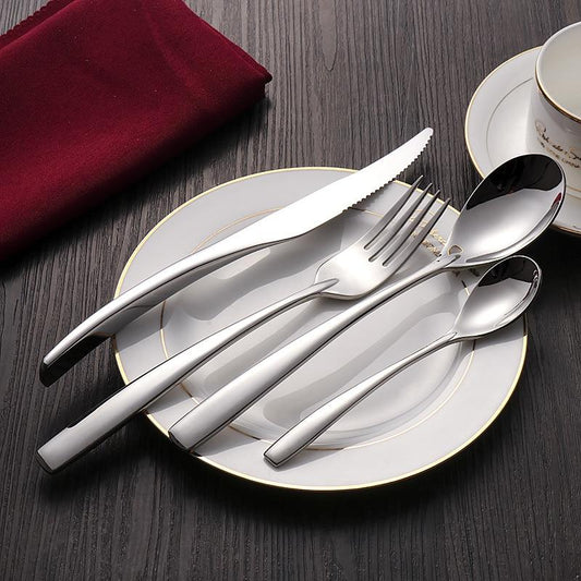 Talia Shiny Silver Flatware 24-Piece Set displayed on a formal table setting with a polished silver finish and tapered profile.