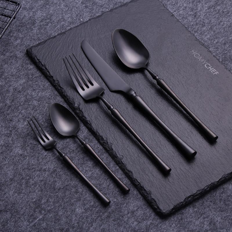 Evangeline Matte Flatware Set 24-Piece on slate board, modern stainless steel design with matte finish, perfect for elegant dining.