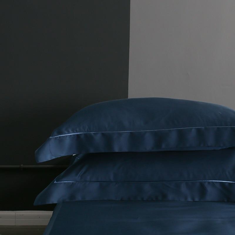 Karen Solid Color Lyocell Duvet Cover Set in blue, showcasing soft Tencel fabric with modern boho style for a cozy bed setup.