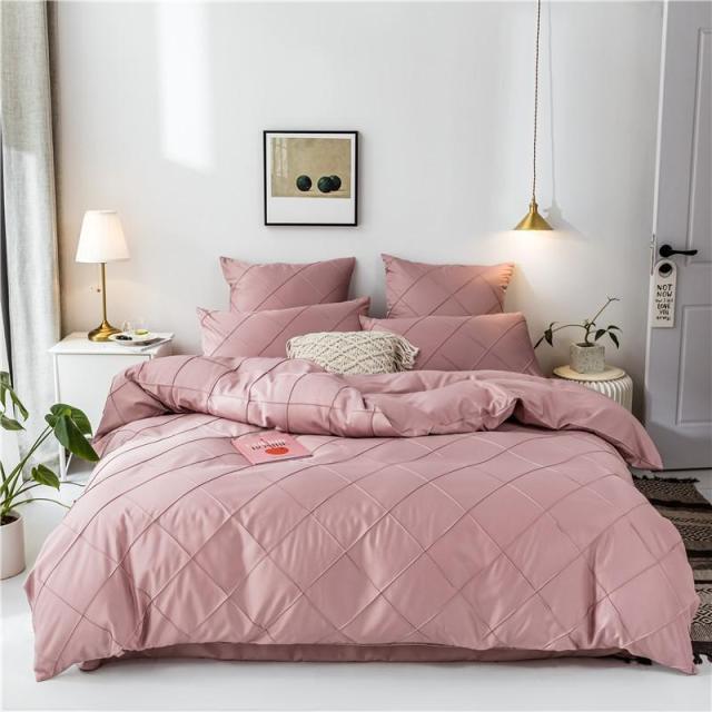 Charlotte Ultra Soft Microfiber Duvet Cover Set in pink on a bed with decorative pillows, perfect for all seasons and comfort.