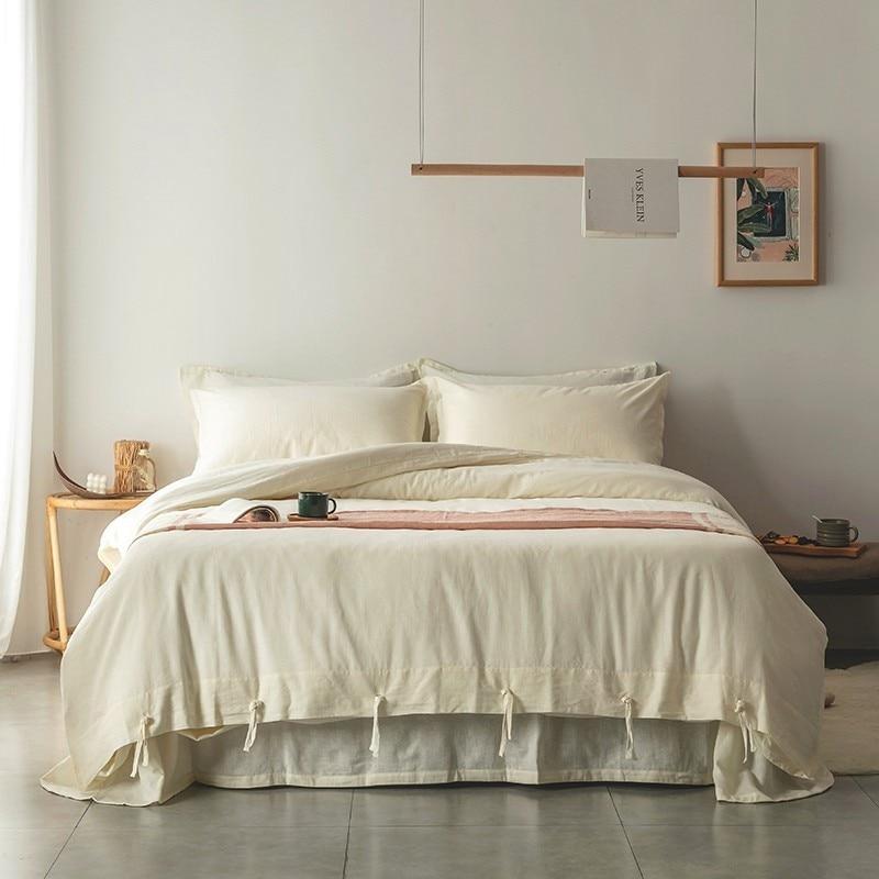 Emma Duvet Cover Set With Ropes 55% Cotton 45% Linen on a neatly made bed in a cozy bedroom setting.