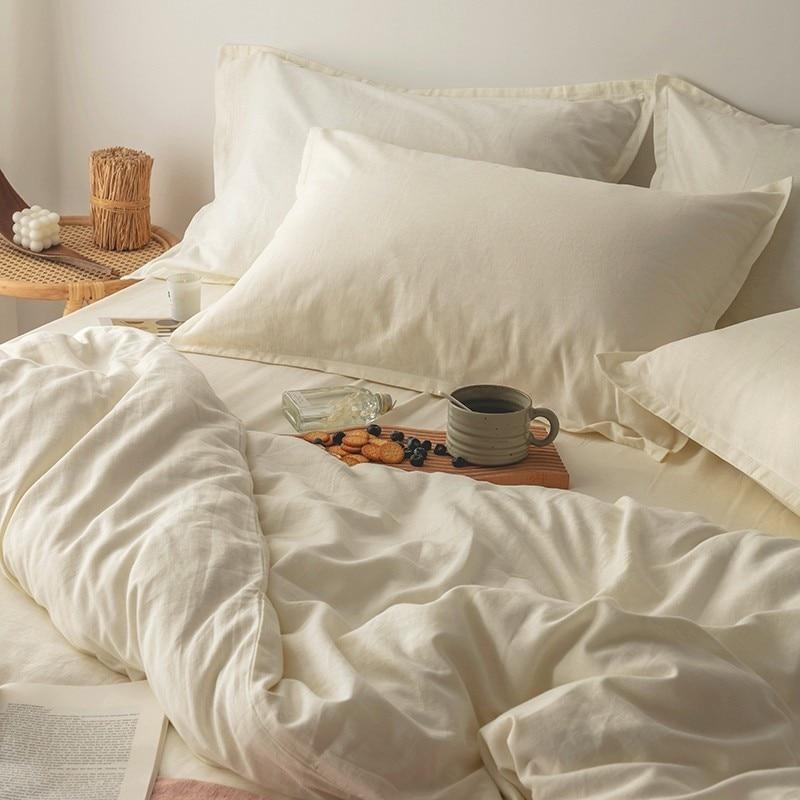 Emma Duvet Cover Set With Ropes 55% Cotton 45% Linen displayed on a bed, featuring soft and cushy bedding in an inviting setting.