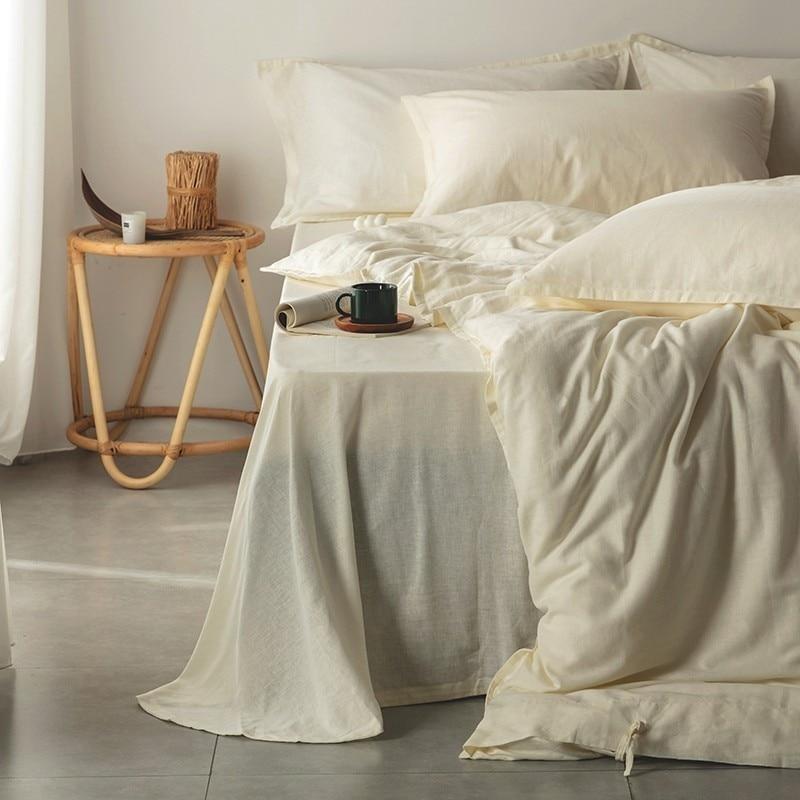 Bedroom with Emma Duvet Cover Set With Ropes 55% Cotton 45% Linen draped over bed, creating a soft and inviting ambiance.