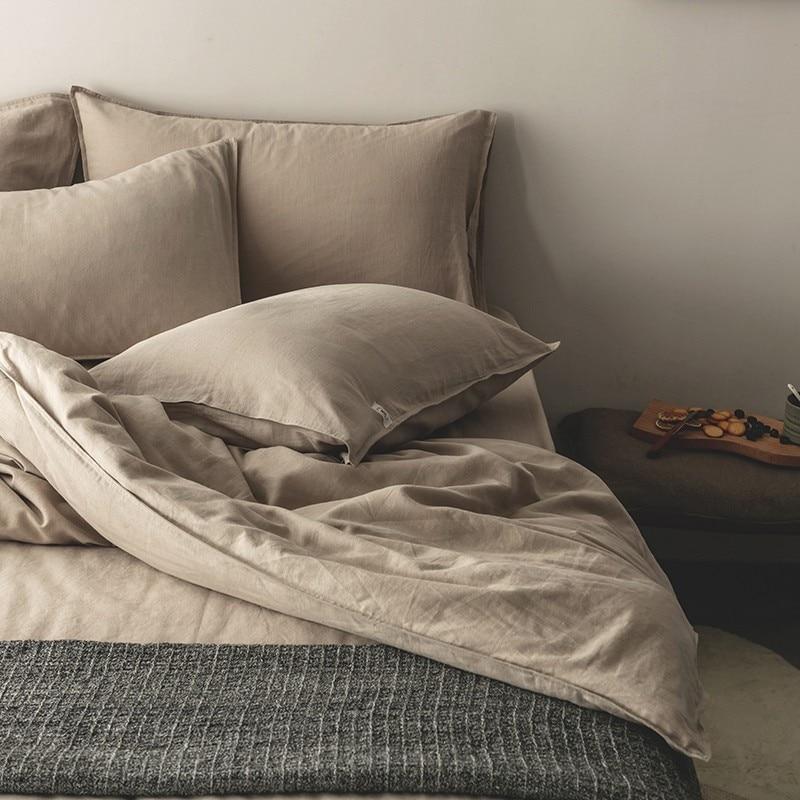 Emma Duvet Cover Set With Ropes 55% Cotton 45% Linen on a cozy bed.