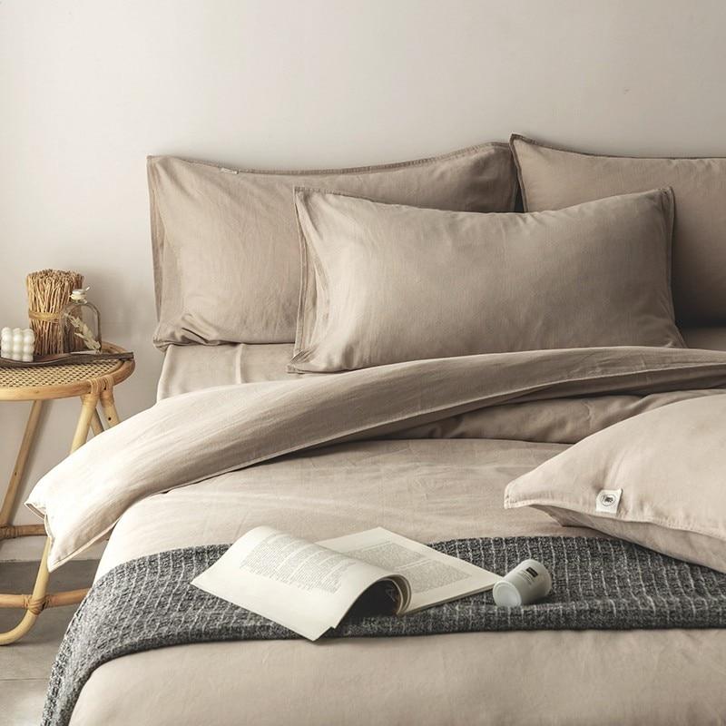 Emma Duvet Cover Set With Ropes 55% Cotton 45% Linen styled on a bed with pillows and decorative accents.