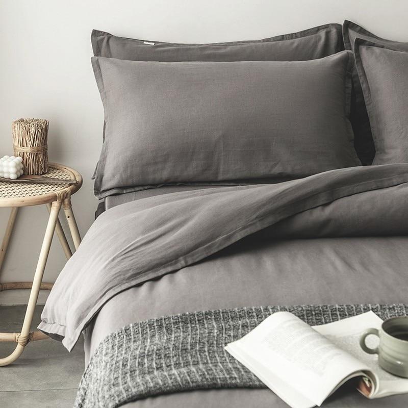 Emma Duvet Cover Set With Ropes 55% Cotton 45% Linen displayed on a bed, showcasing its soft and stylish design.