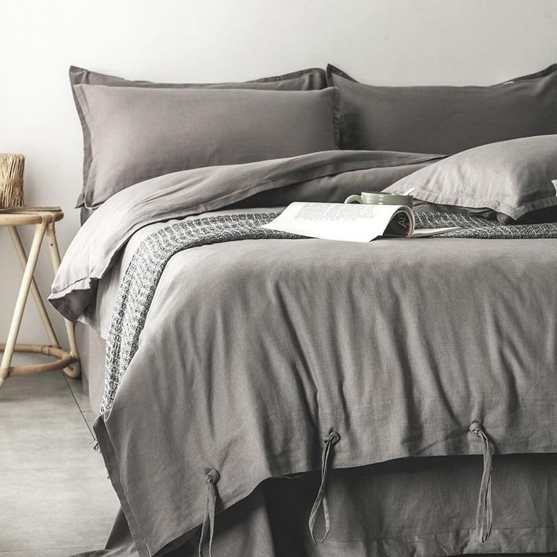 Emma Duvet Cover Set With Ropes 55% Cotton 45% Linen on a bed, featuring a soft and cushy design in a neutral bedroom setting.