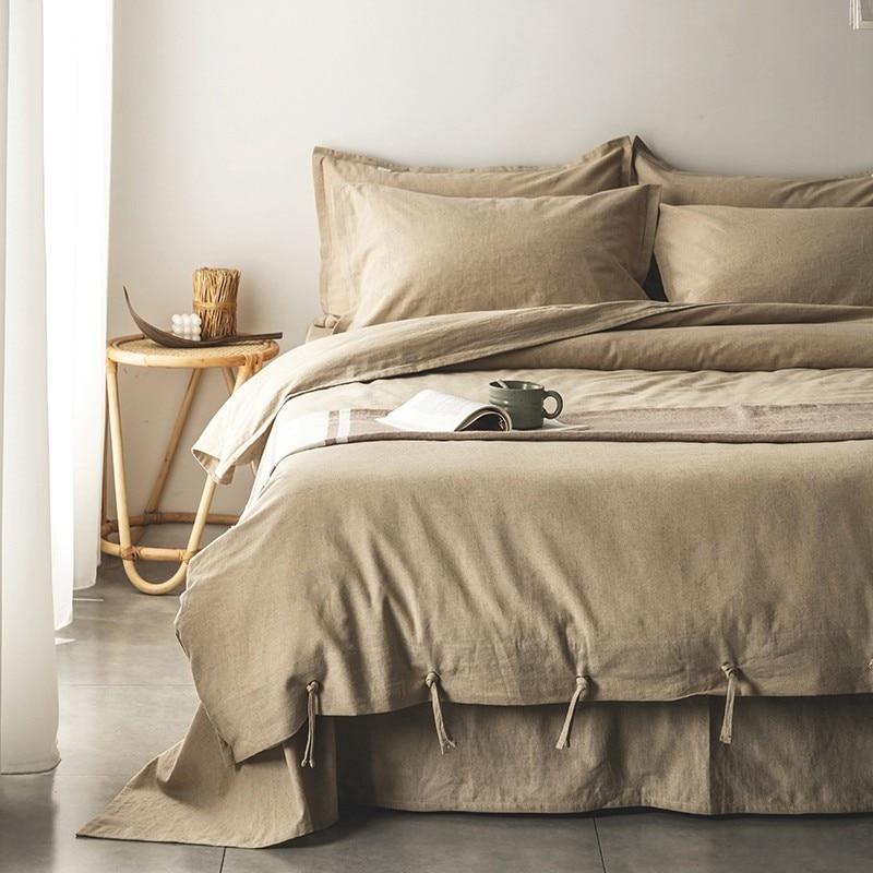 Emma Duvet Cover Set With Ropes 55% Cotton 45% Linen on bed with wooden side table and decor