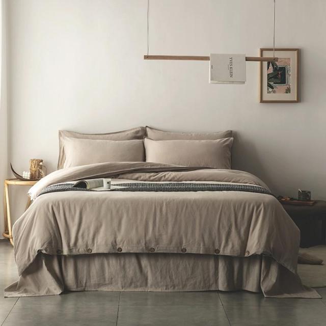 Emma Duvet Cover Set With Ropes 55% Cotton 45% Linen on a neatly made bed, showcasing its soft and cushy texture in a modern bedroom.