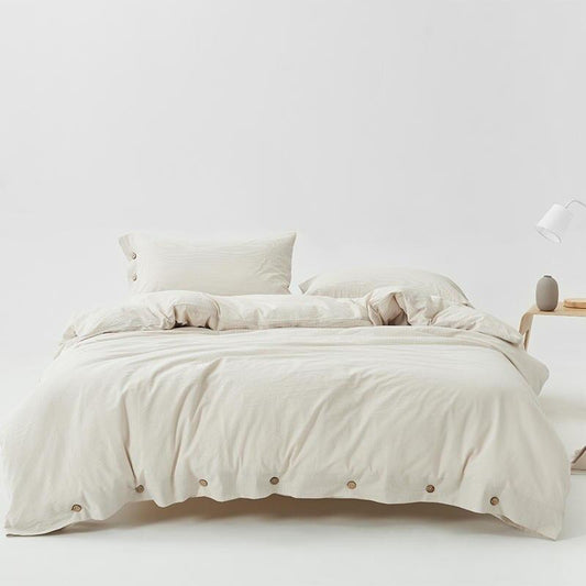 Olivia Stripe Ultra Soft Duvet Cover Set 100% Washed Cotton on bed with pillows and buttons, showcasing elegant design and softness