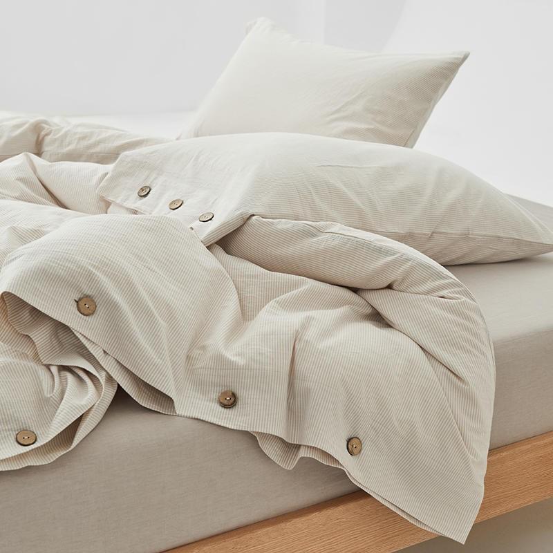 Olivia Stripe Ultra Soft Duvet Cover Set 100% Washed Cotton with buttons on bed, showcasing soft and high-quality washed cotton fabric.