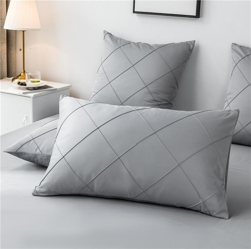 Charlotte Ultra Soft Microfiber Duvet Cover Set in gray on a bed with matching pillows, showcasing quilted design for all-season comfort.