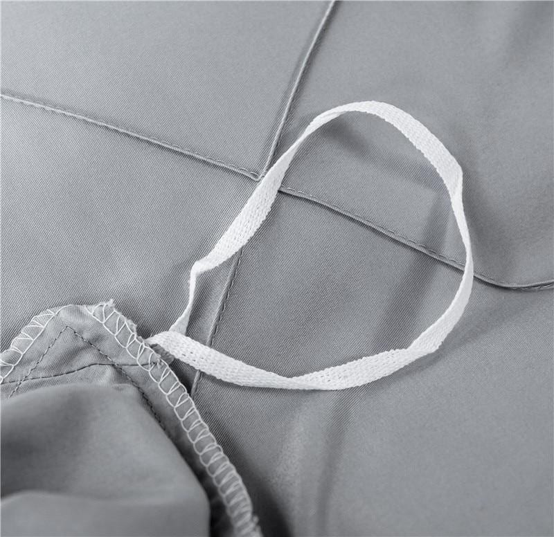 Close-up of Charlotte Ultra Soft Microfiber Duvet Cover Set in light gray, featuring secure corner ties for all season comfort.