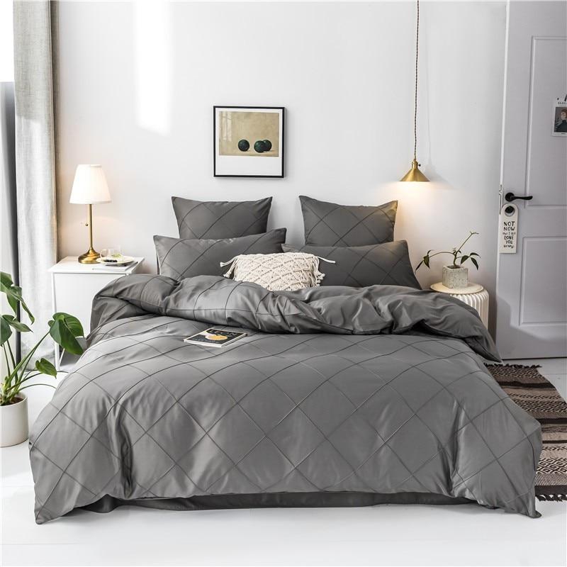 Charlotte Ultra Soft Microfiber Duvet Cover Set on a bed, featuring a modern design, providing comfort and warmth in a stylish bedroom setting.