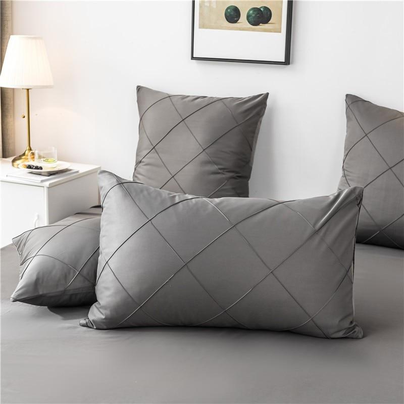 Charlotte Ultra Soft Microfiber Duvet Cover Set in dark gray with matching pillowcases on a bed