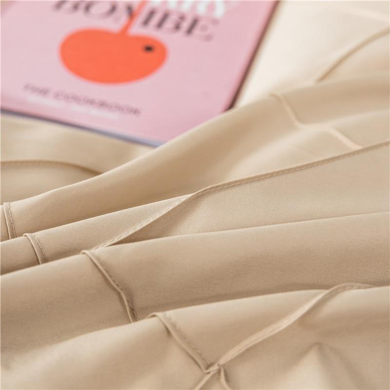 Beige Charlotte Ultra Soft Microfiber Duvet Cover Set with book on bed, all season bedding, lightweight and comfortable