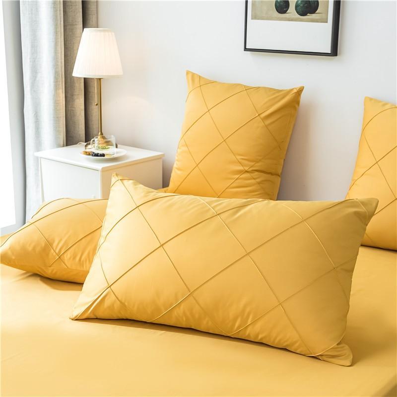 Charlotte Ultra Soft Microfiber Duvet Cover Set in yellow with matching pillowcases styled in a cozy bedroom setting.