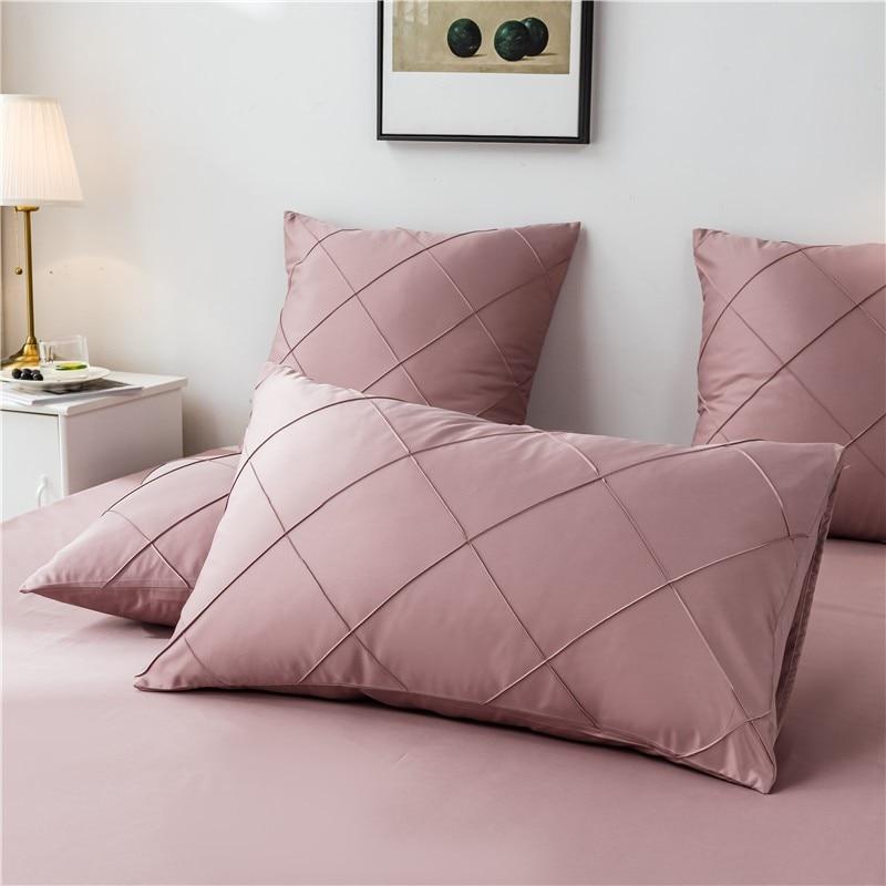 Charlotte Ultra Soft Microfiber Duvet Cover Set in pink displayed on bed with pillows