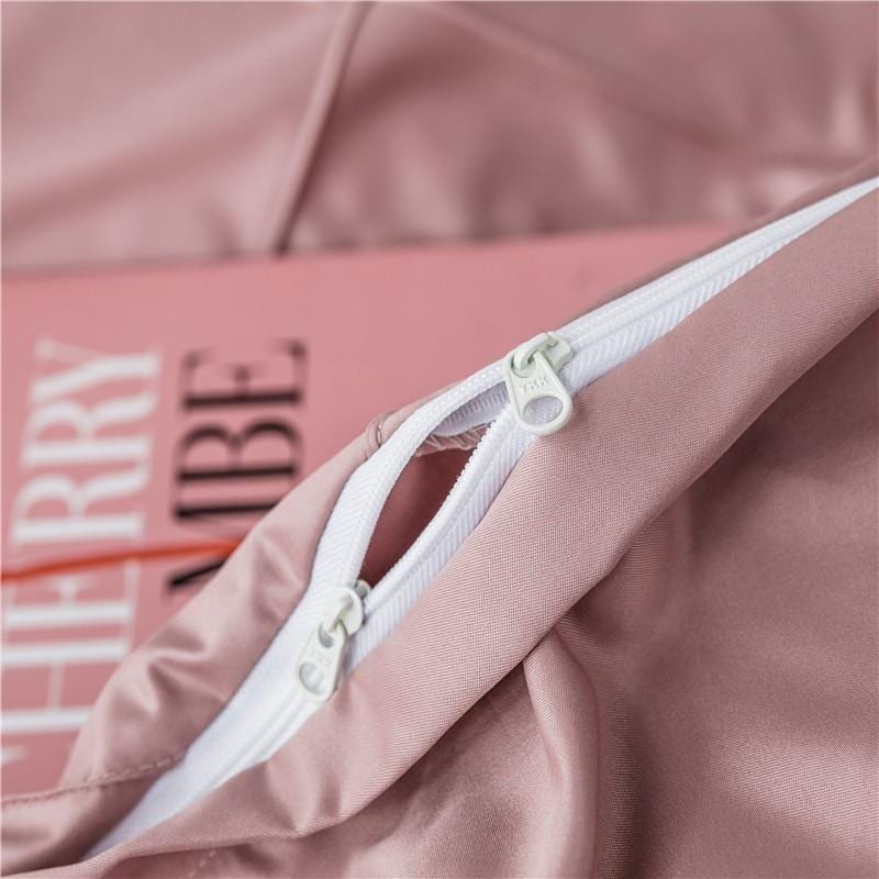Close-up of Charlotte Ultra Soft Microfiber Duvet Cover Set zipper detail in pink.