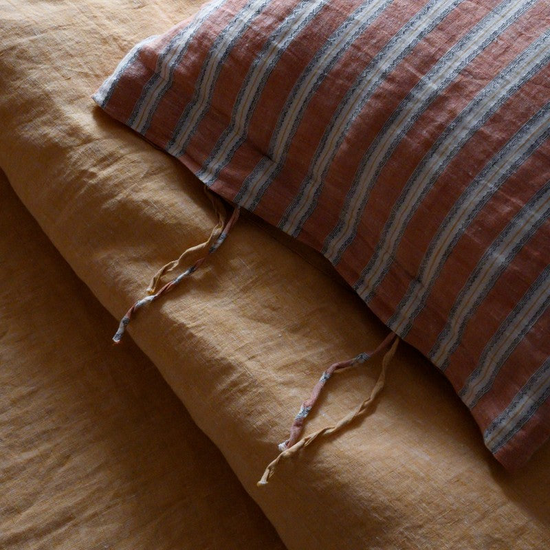 PeachPuff Vertical Stripes 100% Linen Duvet Cover Set with matching pillow sham, showcasing breathable, soft linen bedding.